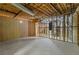 Unfinished basement with concrete floor, exposed framing, visible pipes, and utility connections at 1750 Providence Place Dr, Alpharetta, GA 30009