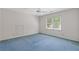 Spacious bedroom with large window, ceiling fan, and blue carpet at 1750 Providence Place Dr, Alpharetta, GA 30009