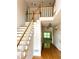 Welcoming foyer with staircase and hardwood floors leading to bright rooms at 1750 Providence Place Dr, Alpharetta, GA 30009