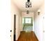 Hallway view featuring modern lighting fixtures and hardwood floors at 1750 Providence Place Dr, Alpharetta, GA 30009