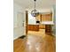 This kitchen features natural wood cabinets, hardwood floors, stainless steel appliances, and center island at 1750 Providence Place Dr, Alpharetta, GA 30009