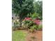 Beautiful landscaping, mature trees and colorful shrubs by the street at 1750 Providence Place Dr, Alpharetta, GA 30009