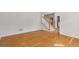 Bright living room with hardwood floors and a view of the staircase at 1750 Providence Place Dr, Alpharetta, GA 30009