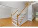 Bright foyer showcasing a classic staircase with wood and white accents at 1750 Providence Place Dr, Alpharetta, GA 30009