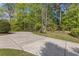 Well-maintained lawn with a concrete driveway leading to a gazebo at 1750 Providence Place Dr, Alpharetta, GA 30009