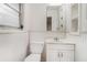 Compact bathroom includes sink, toilet, and mirrored cabinet with storage at 2714 Laurel Ridge Dr, Decatur, GA 30033