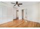 Bedroom featuring hardwood floors, ceiling fan, and closet doors at 2714 Laurel Ridge Dr, Decatur, GA 30033