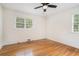 Bedroom with hardwood floors, ceiling fan, and sun-lit windows at 2714 Laurel Ridge Dr, Decatur, GA 30033