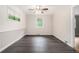 Bedroom featuring laminate flooring, paneling, a ceiling fan, and a window with blinds at 2714 Laurel Ridge Dr, Decatur, GA 30033