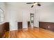 Bedroom with hardwood floors, ceiling fan, trim, and closet doors at 2714 Laurel Ridge Dr, Decatur, GA 30033