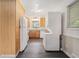 Bright, galley kitchen with modern appliances and stacked laundry units at 2714 Laurel Ridge Dr, Decatur, GA 30033