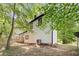 Exterior view of house with backyard, deck, and wooded view at 5401 Martins Crossing Rd, Stone Mountain, GA 30088
