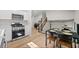 Kitchen features updated appliances and an open view of the dining and living space at 5401 Martins Crossing Rd, Stone Mountain, GA 30088