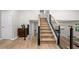 Attractive stairway showcasing natural wood, modern metal railings, and an open design at 5401 Martins Crossing Rd, Stone Mountain, GA 30088