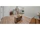 Spacious living room with an open floor plan, light wood flooring, and neutral paint at 5401 Martins Crossing Rd, Stone Mountain, GA 30088