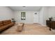 Cozy living room featuring hardwood floors, neutral tones, and lots of natural light at 5401 Martins Crossing Rd, Stone Mountain, GA 30088