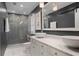 Modern bathroom with a double vanity, marble countertops, and a glass-enclosed shower at 960 Lost Forest Dr, Sandy Springs, GA 30328
