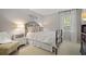 Cozy bedroom features a comfortable bed, soft carpeting, and a peaceful atmosphere at 960 Lost Forest Dr, Sandy Springs, GA 30328