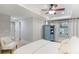 Bedroom featuring a comfortable chair, a blue cabinet, and a bright window at 960 Lost Forest Dr, Sandy Springs, GA 30328