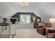 Cozy bonus room with built-in shelving, a window seat, and comfortable seating, perfect for relaxation at 960 Lost Forest Dr, Sandy Springs, GA 30328