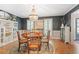 Elegant dining room features a chandelier, hardwood floors, and built-in shelving at 960 Lost Forest Dr, Sandy Springs, GA 30328
