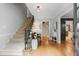 Welcoming foyer featuring hardwood floors, a staircase, and a stylish entryway at 960 Lost Forest Dr, Sandy Springs, GA 30328