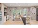 Modern kitchen with a center island, stainless steel sink, and views of the backyard at 960 Lost Forest Dr, Sandy Springs, GA 30328