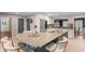 Open kitchen with a large island, stainless steel appliances, and modern finishes at 960 Lost Forest Dr, Sandy Springs, GA 30328