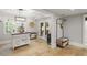 Well-lit mudroom with travertine floors, drop zone, and access to the outside at 960 Lost Forest Dr, Sandy Springs, GA 30328