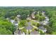 Community aerial view featuring lush trees, manicured lawns, and sidewalks at 947 Summer Forest Drive, Suwanee, GA 30024