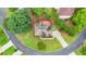 An aerial view of a well-maintained home nestled on a cul-de-sac with lush green landscaping at 947 Summer Forest Drive, Suwanee, GA 30024