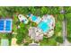 Aerial view of the community pools, clubhouse, and gathering spaces, surrounded by mature trees at 947 Summer Forest Drive, Suwanee, GA 30024