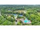 Beautiful aerial view showcases the community amenities including pool, tennis, and playground with green surroundings at 947 Summer Forest Drive, Suwanee, GA 30024