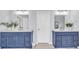 Bathroom featuring double sinks, granite countertops, and blue cabinets at 947 Summer Forest Drive, Suwanee, GA 30024