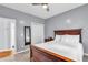 Neutral bedroom with a full-length mirror and a closet at 947 Summer Forest Drive, Suwanee, GA 30024