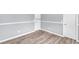 Bedroom featuring wood-look floors, neutral walls and white trim at 947 Summer Forest Drive, Suwanee, GA 30024