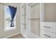 Custom closet with built-in shelving and drawers at 947 Summer Forest Drive, Suwanee, GA 30024