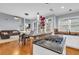 Open kitchen with granite countertops flows into a cozy living space with a fireplace at 947 Summer Forest Drive, Suwanee, GA 30024