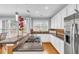 Bright kitchen features stainless steel appliances, granite countertops, and modern lighting at 947 Summer Forest Drive, Suwanee, GA 30024