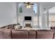 Cozy living room featuring a fireplace, large windows, and comfortable seating at 947 Summer Forest Drive, Suwanee, GA 30024