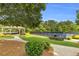 A community tennis court and gazebo providing an ideal leisure spot with lush green landscaping at 947 Summer Forest Drive, Suwanee, GA 30024