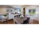 The combined living and dining room has hardwood floors and lots of natural light at 306 Rockledge Sw Bnd, Powder Springs, GA 30127