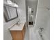 Neutral bathroom with tiled shower/tub and single sink vanity at 710 Montclair Sw Dr, Smyrna, GA 30082