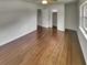 Bedroom features hardwood floors, a ceiling fan, and access to hallway and closets at 710 Montclair Sw Dr, Smyrna, GA 30082