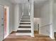 Inviting entryway featuring hardwood floors and a staircase at 710 Montclair Sw Dr, Smyrna, GA 30082