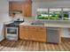 Modern kitchen featuring updated appliances, granite countertops, and ample cabinet space at 710 Montclair Sw Dr, Smyrna, GA 30082