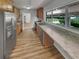Modern kitchen featuring stainless steel appliances, granite countertops, and ample cabinet space at 710 Montclair Sw Dr, Smyrna, GA 30082