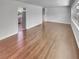 Spacious living area featuring hardwood floors, with an entry view of the kitchen at 710 Montclair Sw Dr, Smyrna, GA 30082