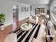 Bright living room with hardwood floors, neutral decor, and modern furniture arrangement at 710 Montclair Sw Dr, Smyrna, GA 30082