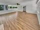 Spacious living room with hardwood floors, white brick walls, and natural light at 710 Montclair Sw Dr, Smyrna, GA 30082